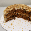 Carrot Cake With Raisins & Walnuts, finished with a tasty cream cheese frosting and toasted walnuts