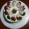 Red Velvet Cake with Cream Cheese Frosting, topped with White Chocolate Covered Strawberries